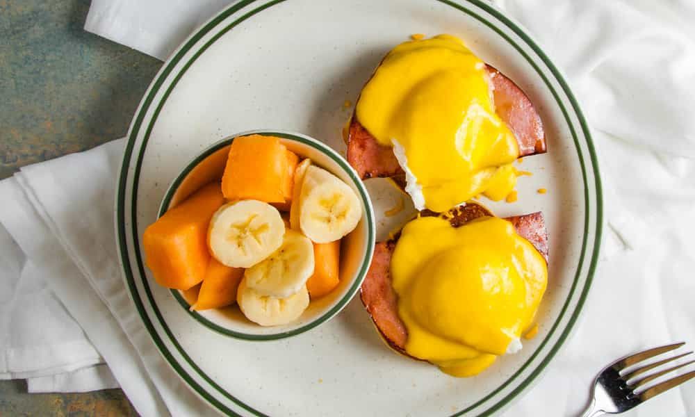 Classic eggs benedict with poached eggs and rich hollandaise sauce