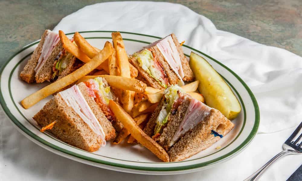 Fresh sandwich with premium ingredients, served with fries