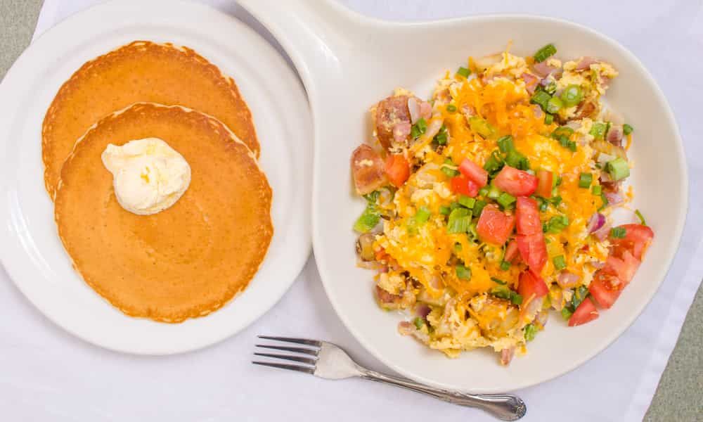 Hearty breakfast skillet scrambled with eggs, meat, and cheese